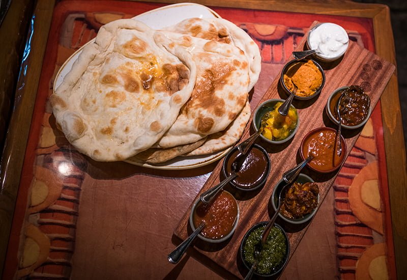 Sanaa signature dishes Indian-style Bread ServicePotjie Inspired Zanzibari Vegetable Curry